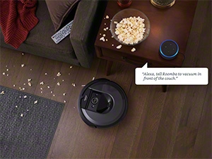 A robotic vacuum working in a kitchen, demonstrating its ability to clean under furniture and appliances.