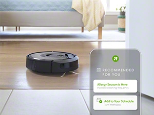 The vacuum working in a bright, modern living room, tailored for personalized cleaning.